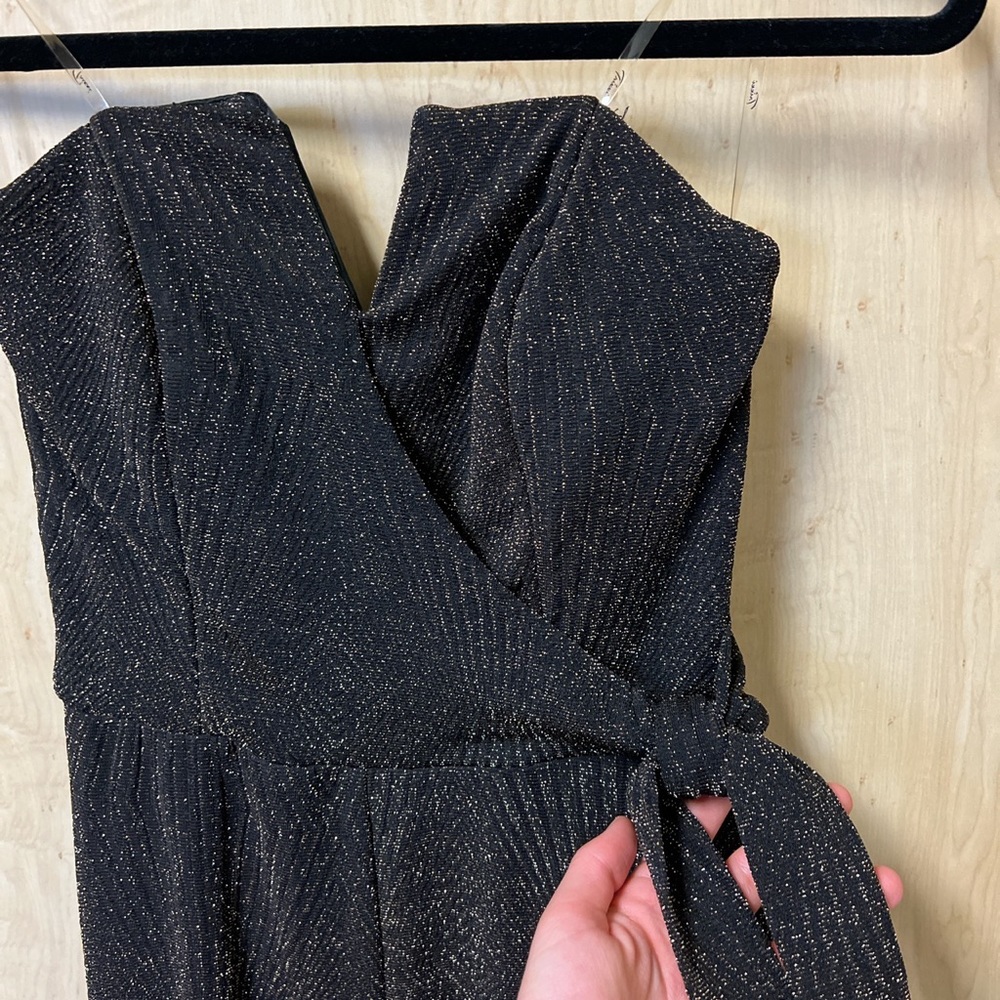 Black and gold elegant  jumpsuit. Skinny fit, sleeveless.